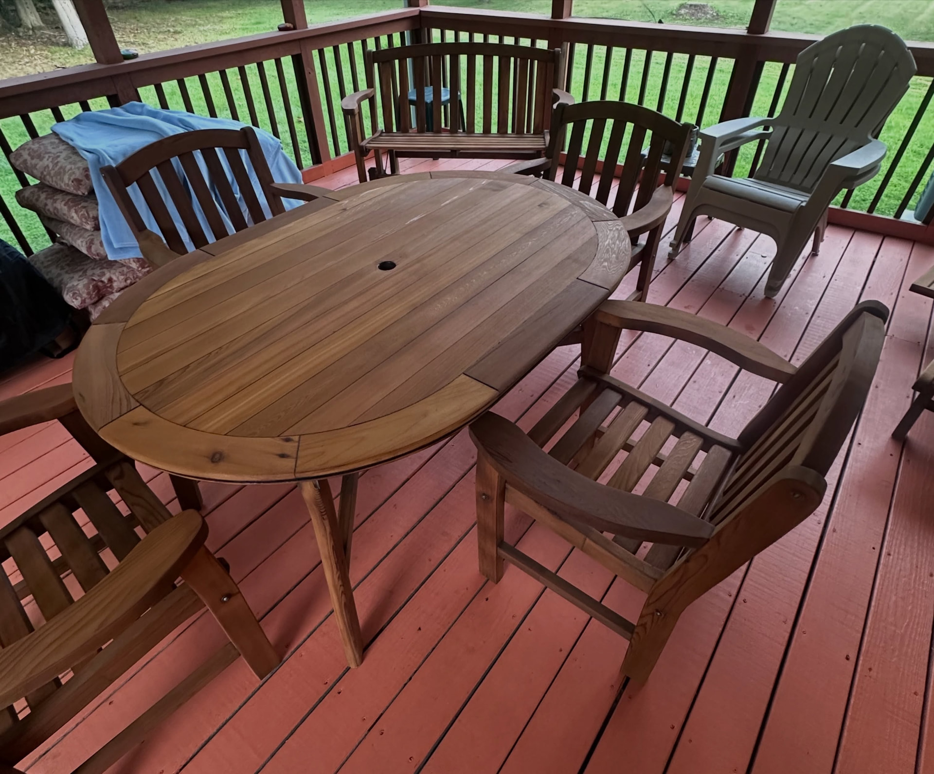 Restored teak patio dining set on a Harford County deck