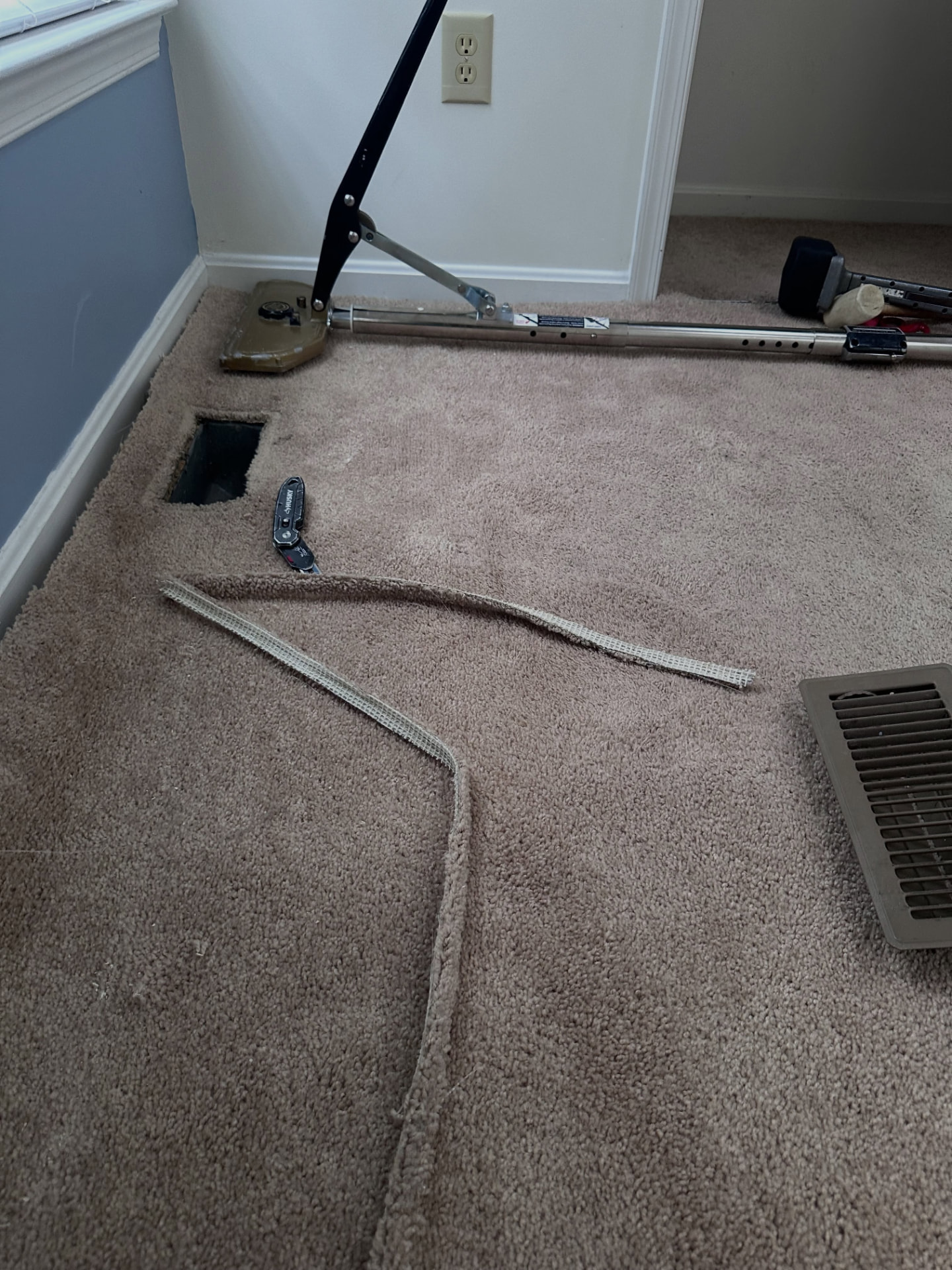 Carpet seam repair with tape and a power stretcher