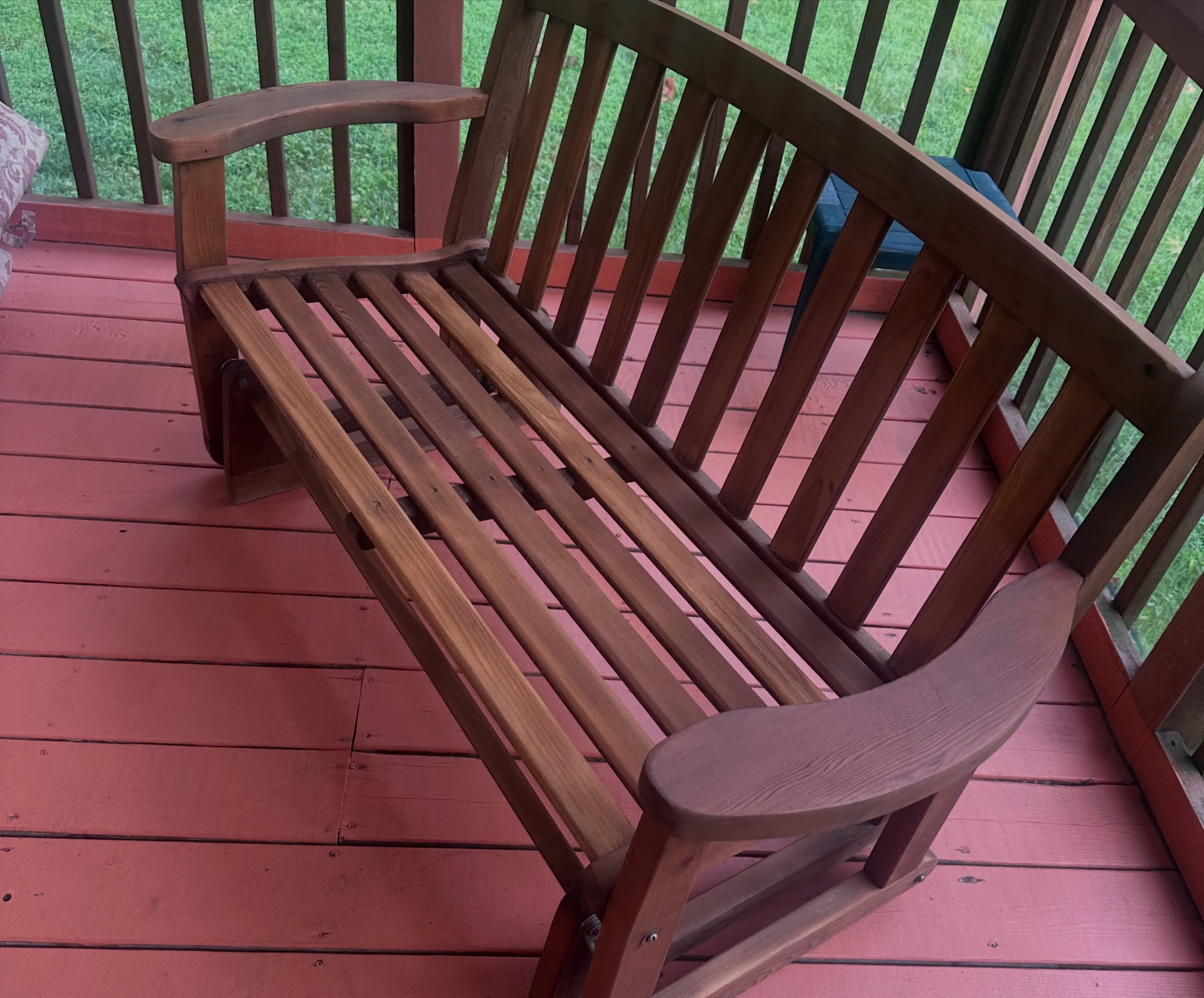 Restored teak bench on a covered deck